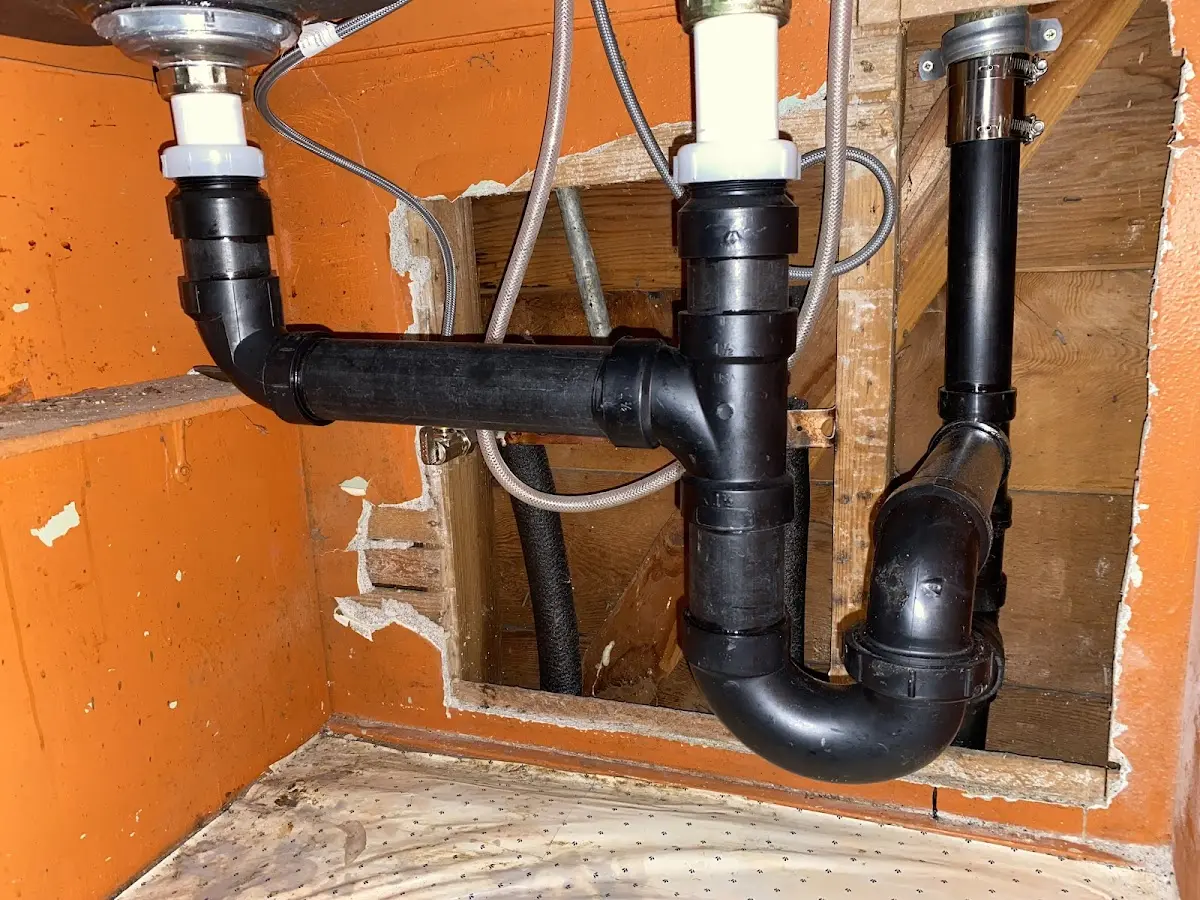 Professional Garbage Disposal Repair equipment and tools on the job in Harwood Heights